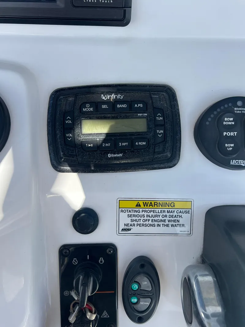 Slide: The Image of Control panel of a 2014 Sportsman Masters 247 Bay Boat with warning label. - 9
