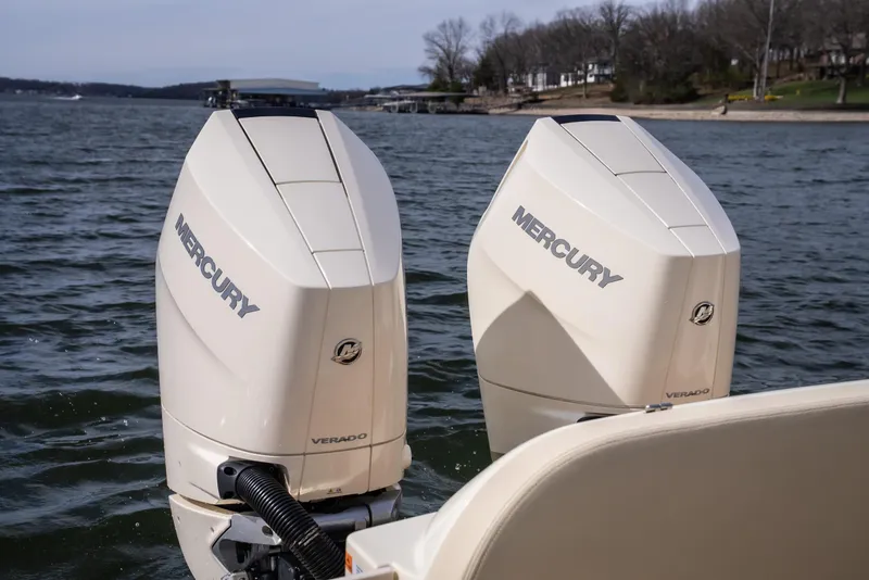 Slide: The Image of 2024 Chris-Craft Calypso 35 CP with dual Mercury outboard engines on a lake. - 13