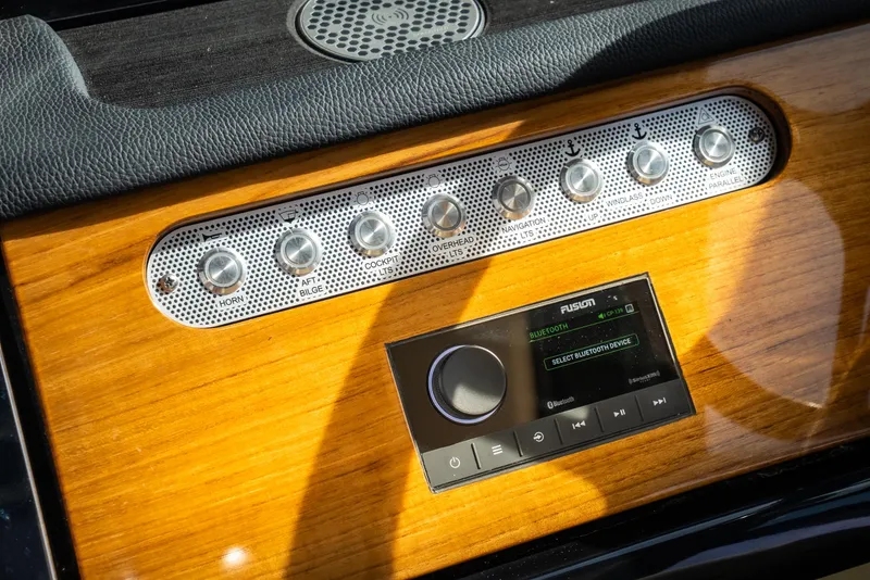 Slide: The Image of 2024 Chris-Craft Calypso 35 CP dashboard with control panel and audio system. - 23