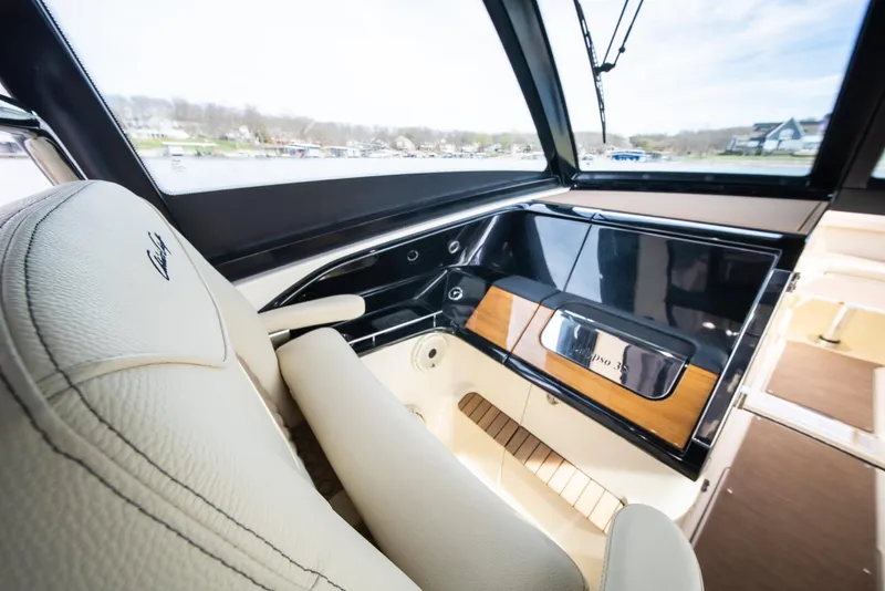 Slide: The Image of 2024 Chris-Craft Calypso 35 CP interior with luxurious seating and sleek dashboard design. - 25
