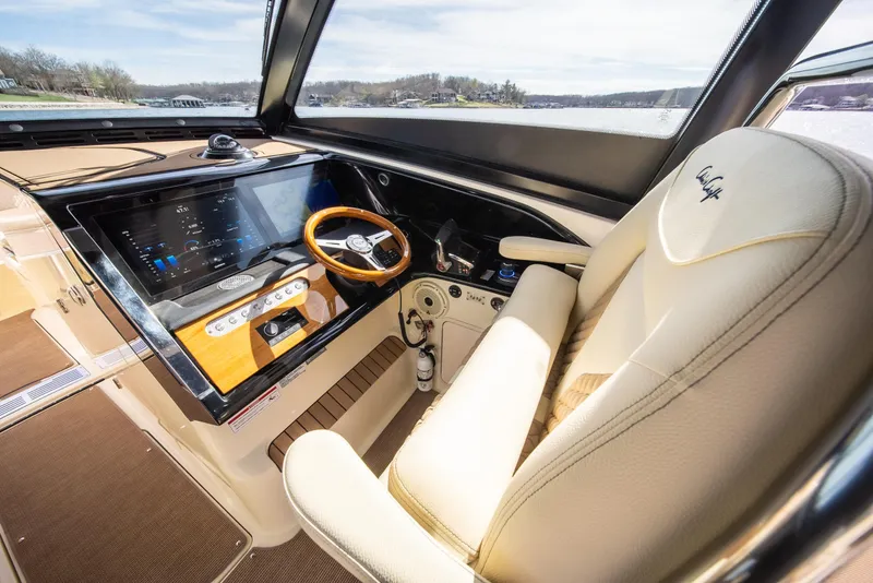 Slide: The Image of 2024 Chris-Craft Calypso 35 CP helm with luxurious seating and advanced controls. - 26
