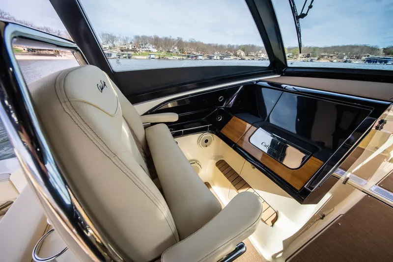 Slide: The Image of 2024 Chris-Craft Calypso 35 CP interior with luxurious seating and sleek dashboard design. - 27
