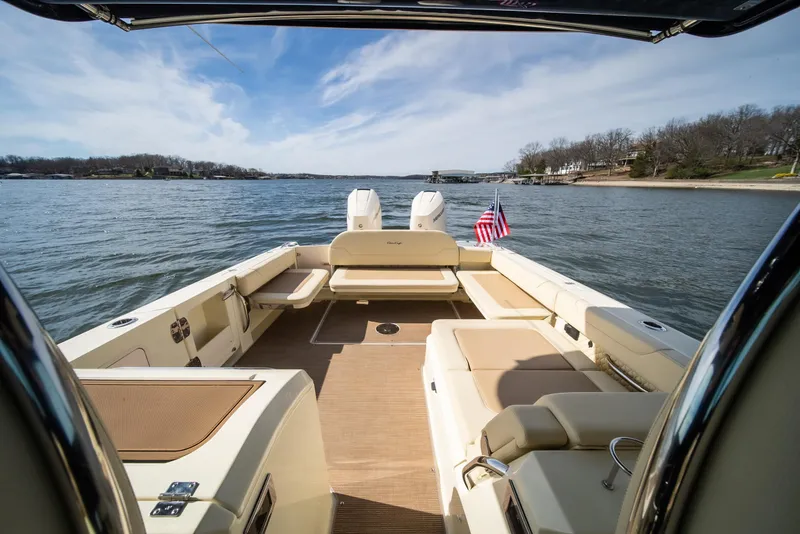 Slide: The Image of 2024 Chris-Craft Calypso 35 CP boat interior with lake view and American flag. - 28