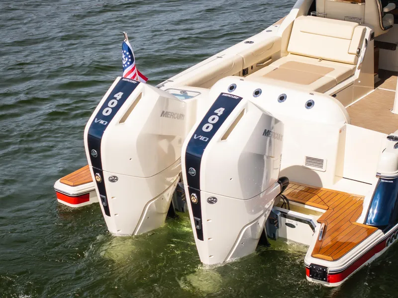 Slide: The Image of 2024 Chris-Craft Calypso 35 CP with dual Mercury 400 V10 engines on water. - 3