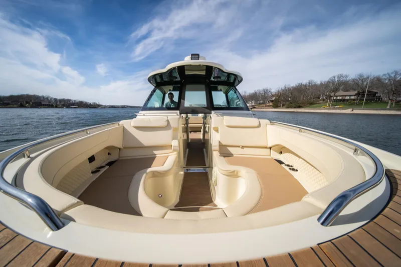 Slide: The Image of 2024 Chris-Craft Calypso 35 CP boat with spacious seating on a sunny day. - 38