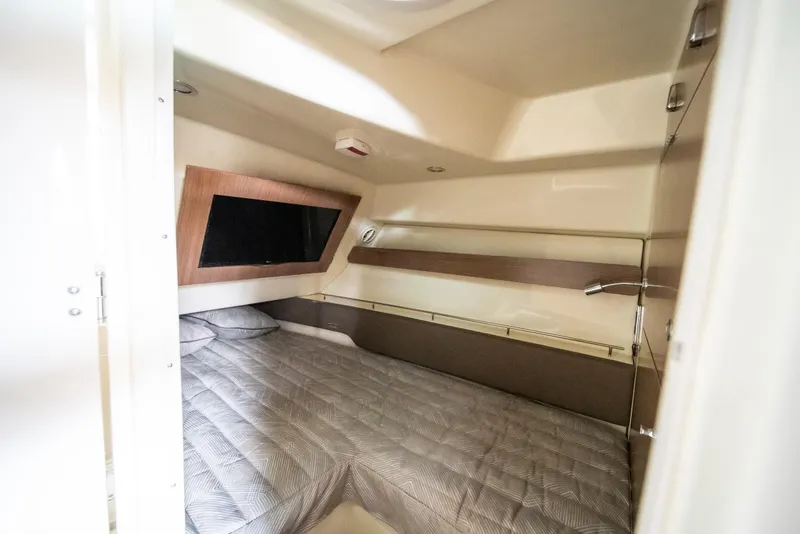 Slide: The Image of 2024 Chris-Craft Calypso 35 CP cabin interior with bed and window. - 41