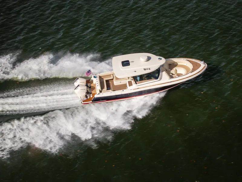 Slide: The Image of 2024 Chris-Craft Calypso 35 CP cruising swiftly on open water. - 8