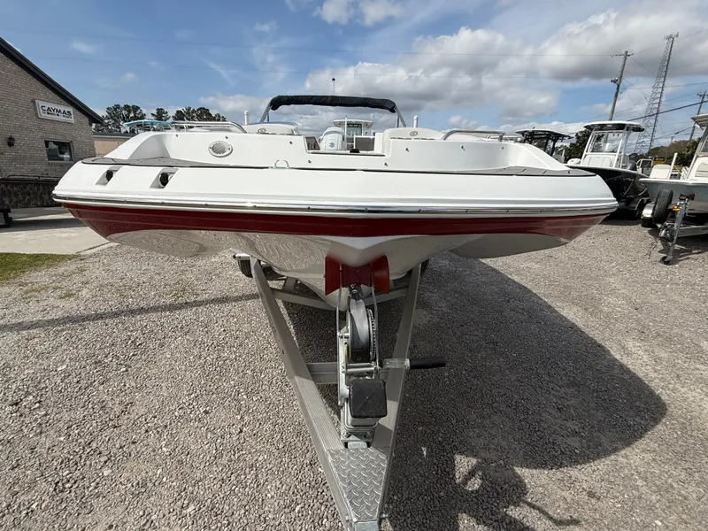 Slide: The Image of 2023 Hurricane SunDeck Sport 188 OB boat on trailer, front view, outdoors. - 15