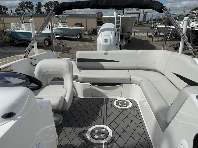 Slide: The Image of 2023 Hurricane SunDeck Sport 188 OB boat interior with seating and steering wheel. - 22