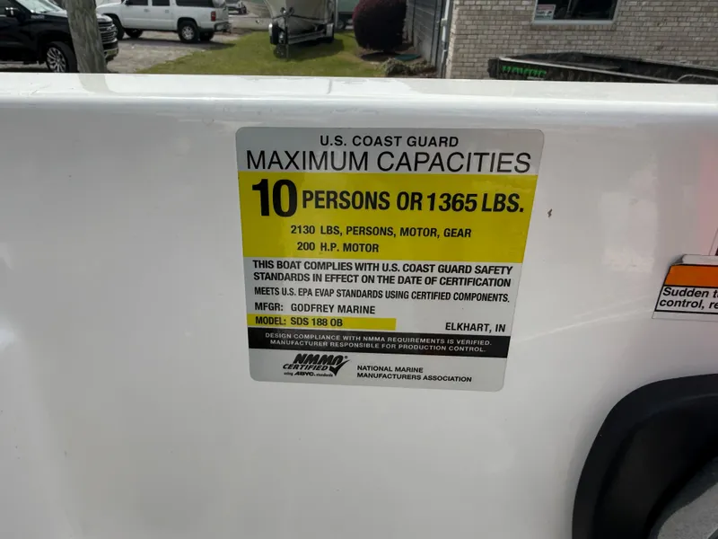 Slide: The Image of 2023 Hurricane SunDeck Sport 188 OB capacity label, 10 persons or 1365 lbs, 200 HP motor. - 25