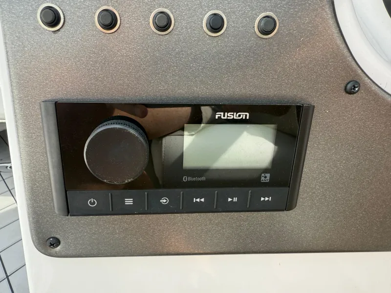 Slide: The Image of Fusion audio system on 2023 Hurricane SunDeck Sport 188 OB boat dashboard. - 26