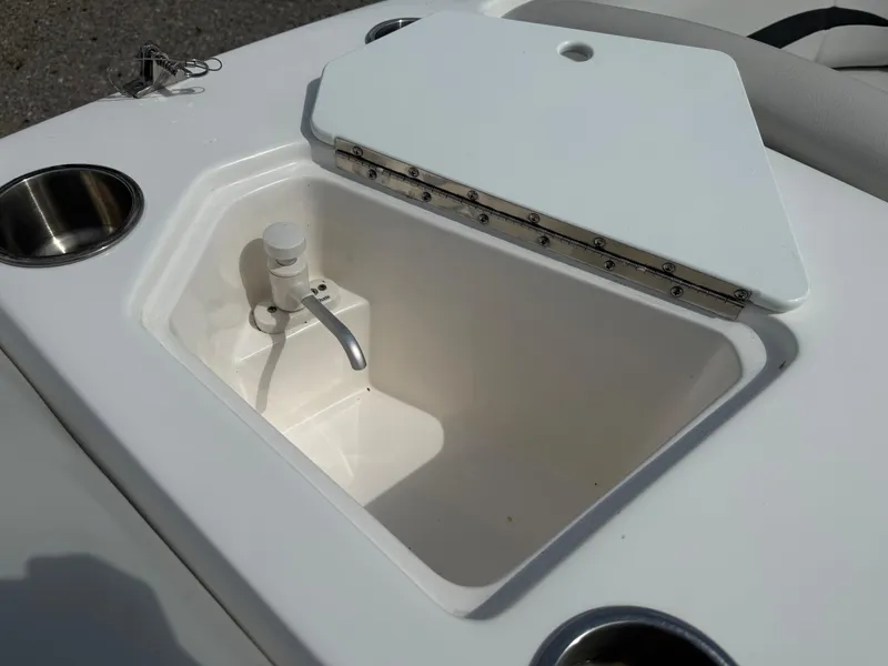 Slide: The Image of Open storage compartment on 2023 Hurricane SunDeck Sport 188 OB boat. - 31