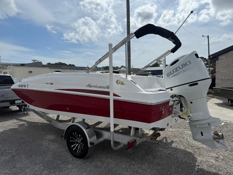 Slide: The Image of 2023 Hurricane SunDeck Sport 188 OB boat with Suzuki outboard motor on trailer. - 8
