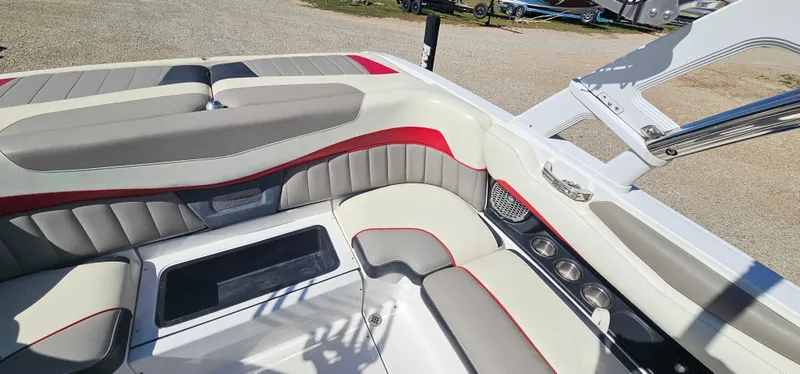 Slide: The Image of 2013 Malibu Wakesetter 23 MXZ interior with gray and red seating, showcasing luxury and comfort. - 20