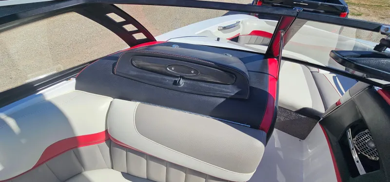 Slide: The Image of 2013 Malibu Wakesetter 23 MXZ interior with red and white seating. - 27