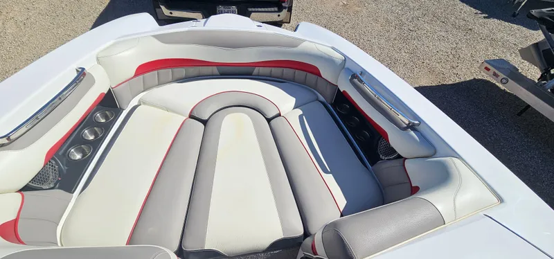 Slide: The Image of 2013 Malibu Wakesetter 23 MXZ boat interior with cushioned seating and cup holders. - 29