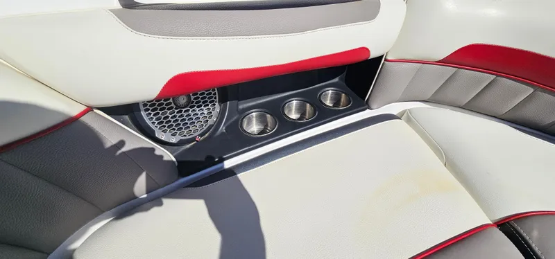 Slide: The Image of Interior of 2013 Malibu Wakesetter 23 MXZ with cup holders and speaker. - 30