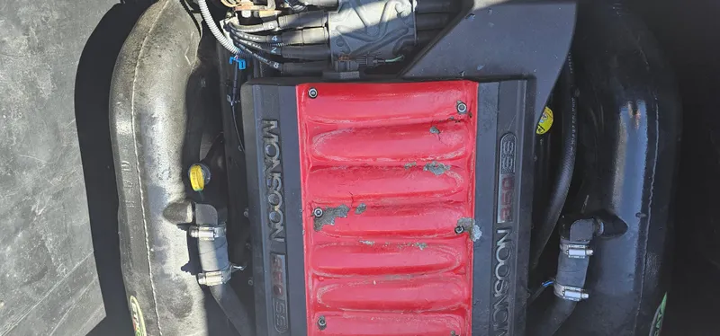 Slide: The Image of Engine of 2013 Malibu Wakesetter 23 MXZ with red Monsoon cover. - 34