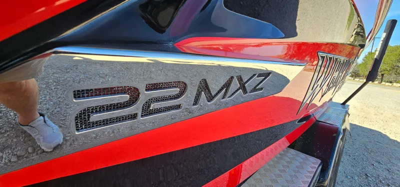 Slide: The Image of Close-up of a 2013 Malibu Wakesetter 23 MXZ boat with "22 MXZ" decal. - 5