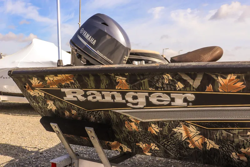 Slide: The Image of 2015 Ranger RT178 boat with Yamaha motor, featuring camouflage design and autumn leaves. - 11