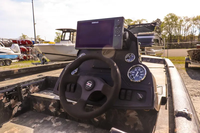 Slide: The Image of 2015 Ranger RT178 boat dashboard with steering wheel and navigation display. - 13