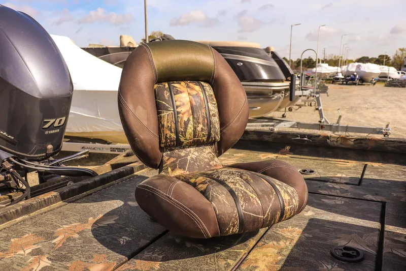 Slide: The Image of Camouflage seat on 2015 Ranger RT178 boat, with outboard motor in background. - 15