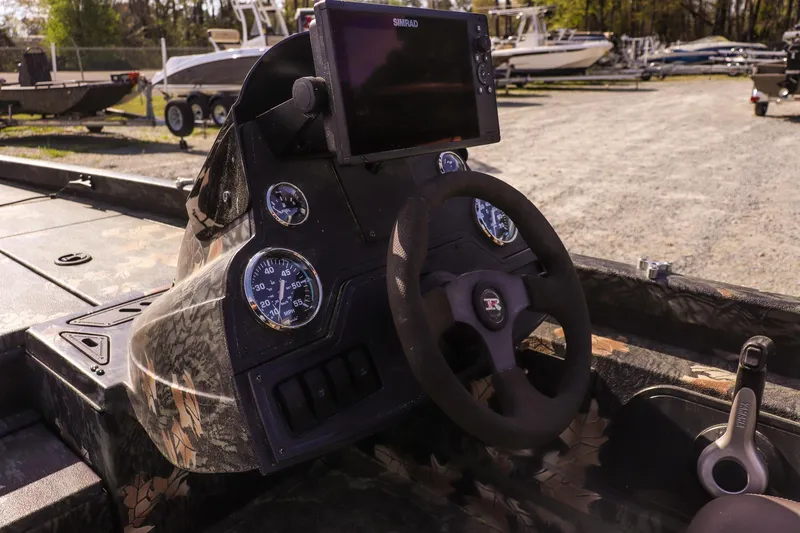 Slide: The Image of 2015 Ranger RT178 boat dashboard with steering wheel and navigation system. - 19