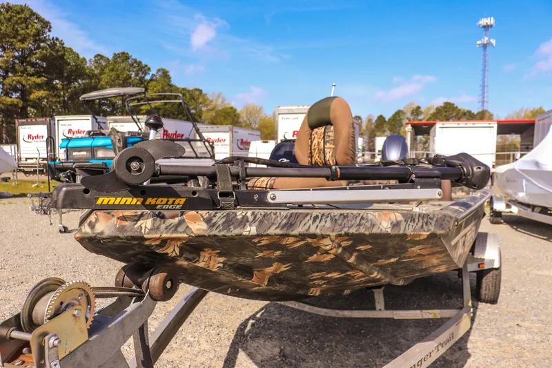 Slide: The Image of 2015 Ranger RT178 boat with camo design and Minn Kota trolling motor on trailer. - 8