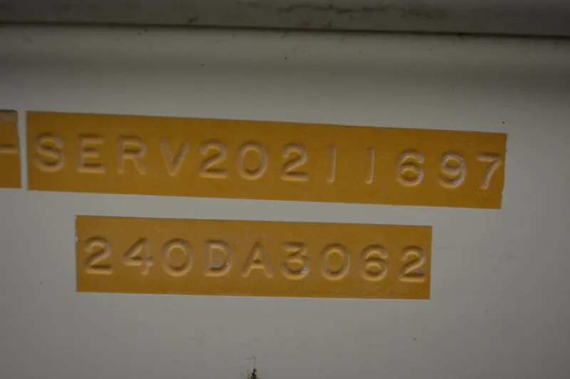Slide: The Image of Serial numbers on a 1997 Sea Ray 240 Sundancer boat hull. - 10