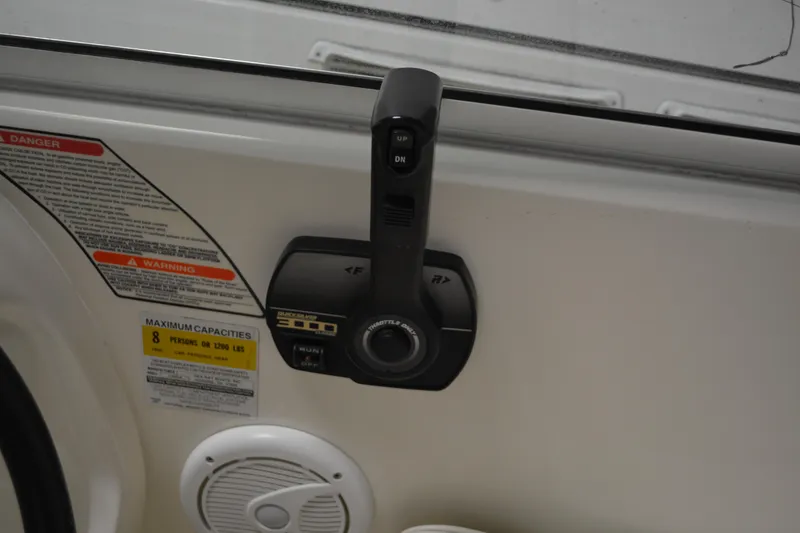 Slide: The Image of Throttle control on a 1997 Sea Ray 240 Sundancer boat dashboard. - 14