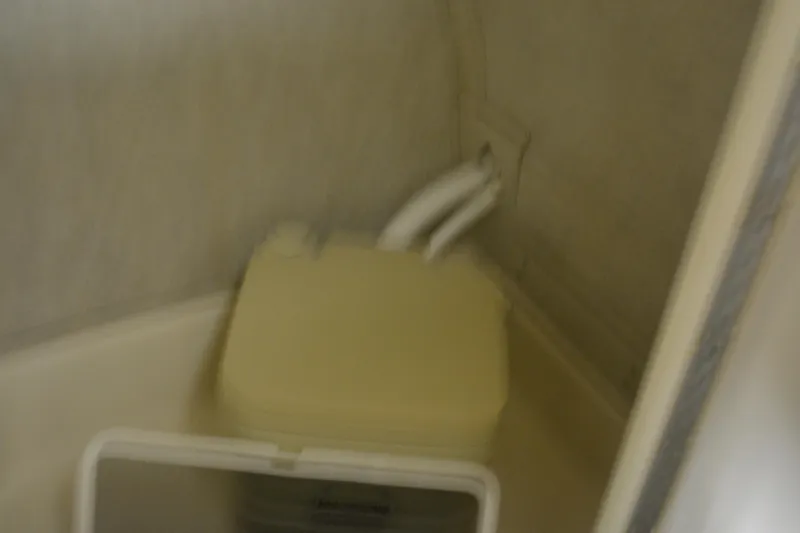 Slide: The Image of 1997 Sea Ray 240 Sundancer boat bathroom with compact toilet. - 33