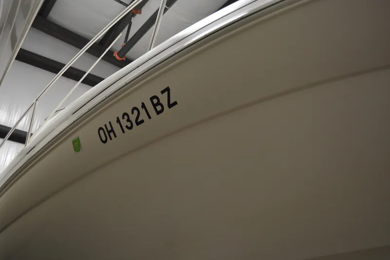 Slide: The Image of 1997 Sea Ray 240 Sundancer boat with registration OH 1321 BZ in storage. - 4