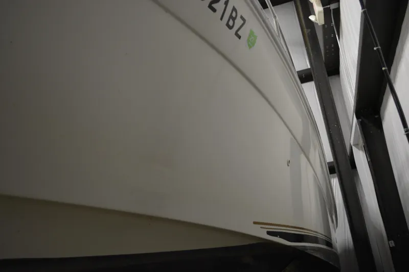 Slide: The Image of 1997 Sea Ray 240 Sundancer boat in storage, viewed from below. - 8