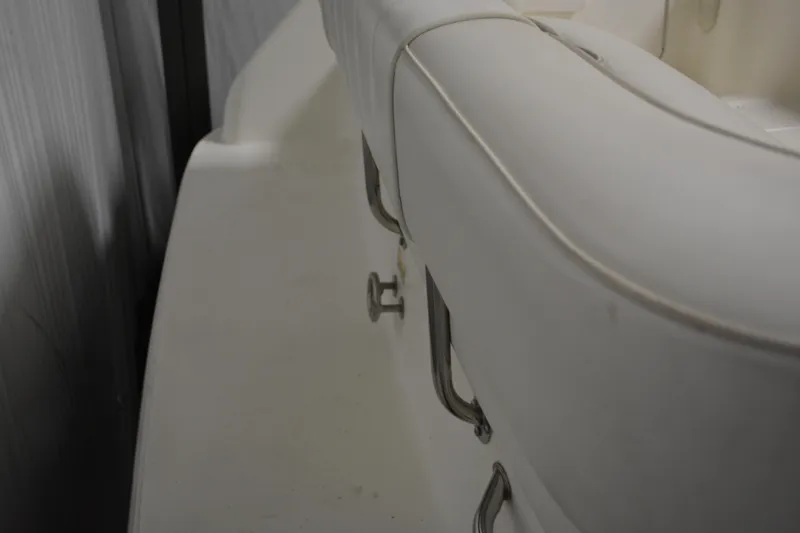Slide: The Image of Close-up of 1997 Sea Ray 240 Sundancer boat interior with white seating. - 9