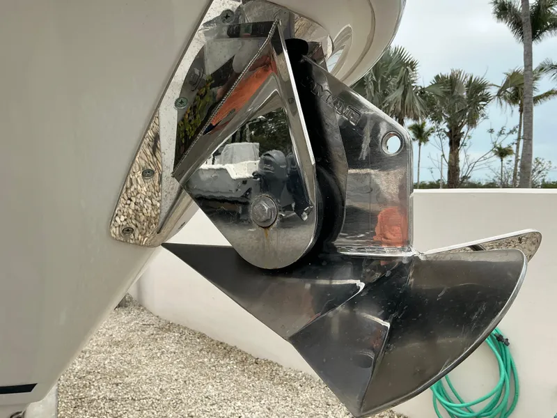 Slide: The Image of 2023 Boston Whaler 240 Vantage anchor detail with tropical background. - 17
