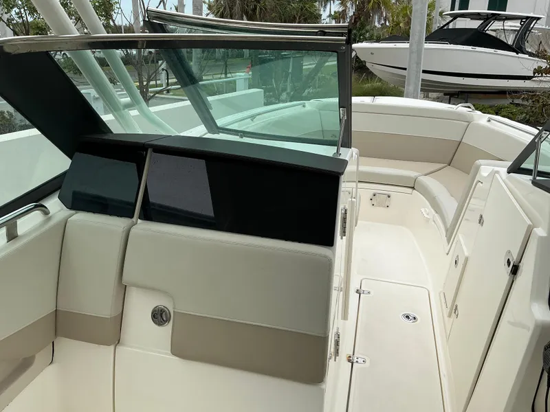 Slide: The Image of 2023 Boston Whaler 240 Vantage boat interior with seating and windshield. - 22