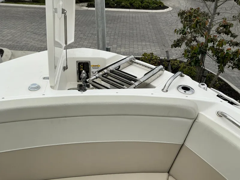 Slide: The Image of 2023 Boston Whaler 240 Vantage boat with swim ladder and seating area. - 26