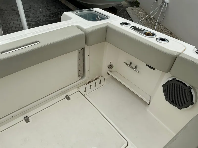 Slide: The Image of 2023 Boston Whaler 240 Vantage boat interior, featuring seating and storage compartments. - 32