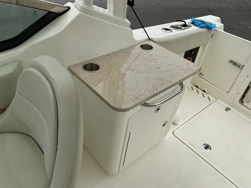 Slide: The Image of 2023 Boston Whaler 240 Vantage boat interior with seating and countertop. - 39
