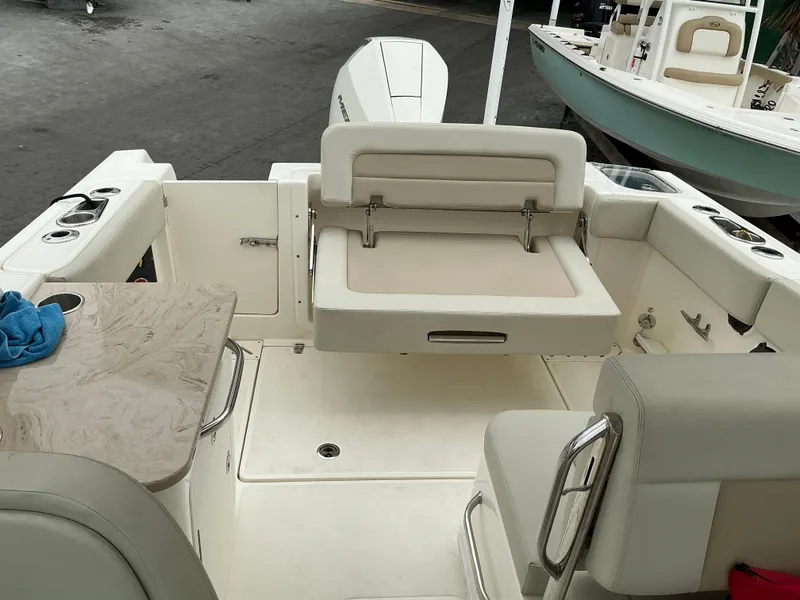 Slide: The Image of 2023 Boston Whaler 240 Vantage boat interior with seating and table. - 41