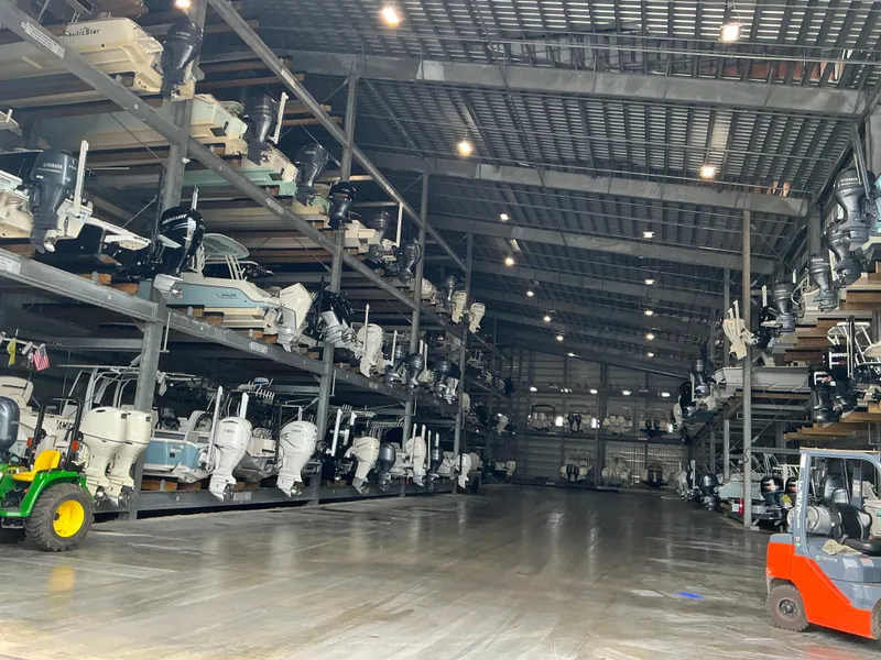 Slide: The Image of Indoor boat storage with multiple Boston Whaler 240 Vantage boats, 2023 models, neatly arranged on racks. - 42