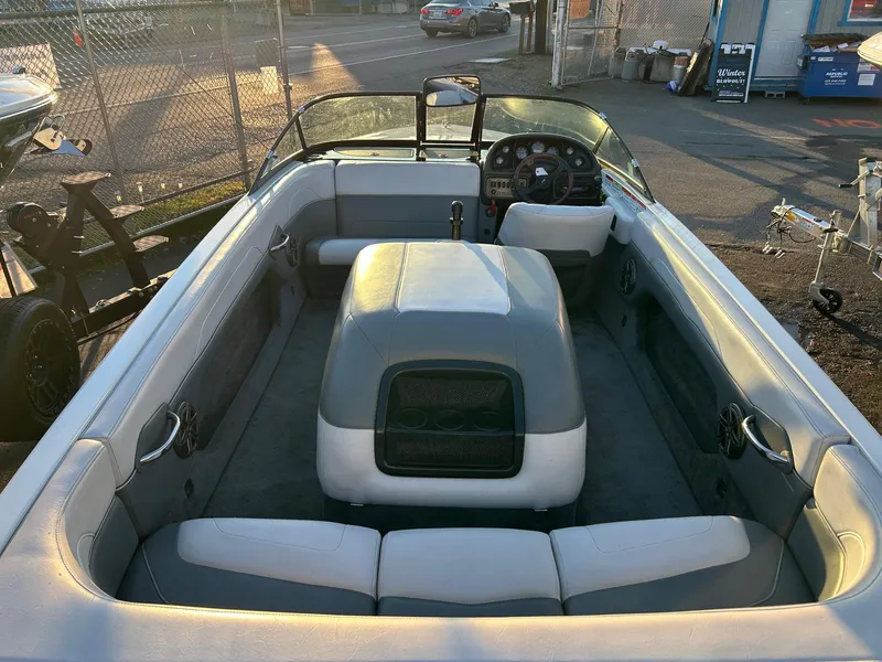 Slide: The Image of 1999 Toyota Epic 21 boat interior with seating and steering wheel, parked outdoors. - 11
