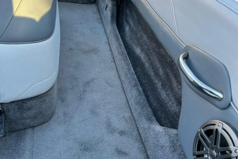 Slide: The Image of Interior of a 1999 Toyota Epic 21, featuring gray carpet and upholstery. - 13