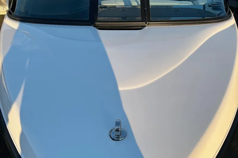 Slide: The Image of 1999 Toyota Epic 21 boat, white hull, close-up view. - 16