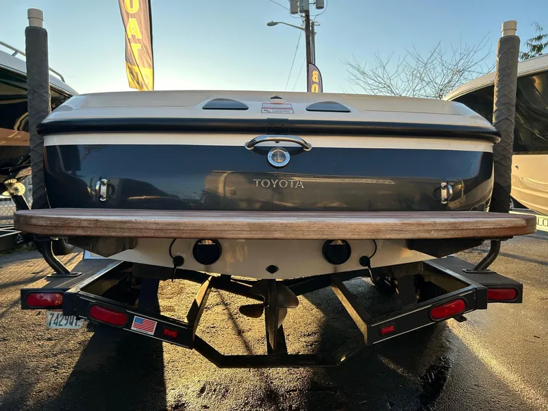 Slide: The Image of 1999 Toyota Epic 21 boat rear view on trailer, outdoor setting. - 3
