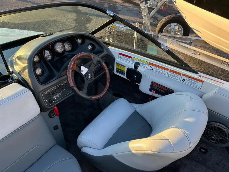 Slide: The Image of 1999 Toyota Epic 21 boat interior with steering wheel and dashboard controls. - 4