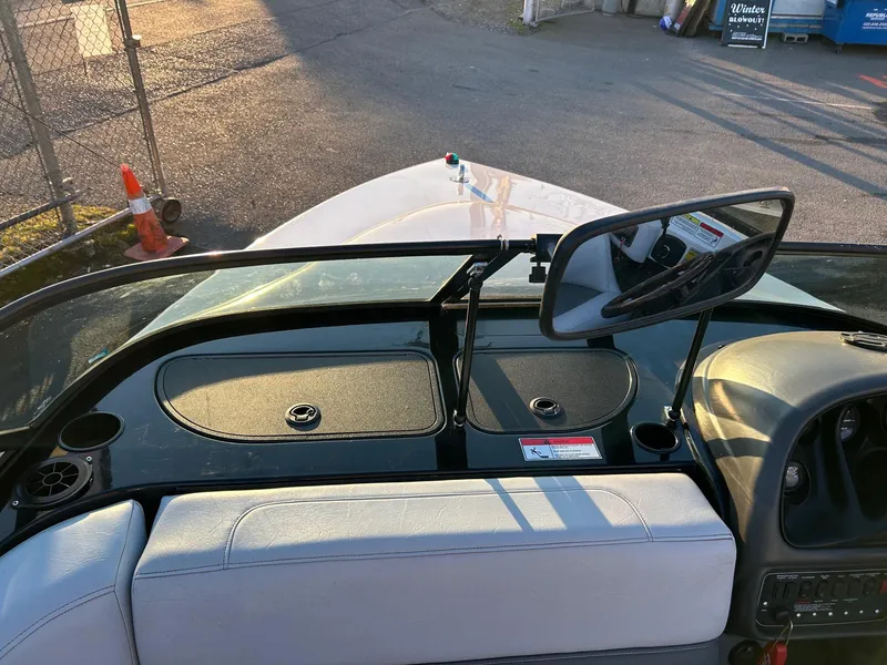 Slide: The Image of 1999 Toyota Epic 21 boat interior with dashboard and rearview mirror. - 9