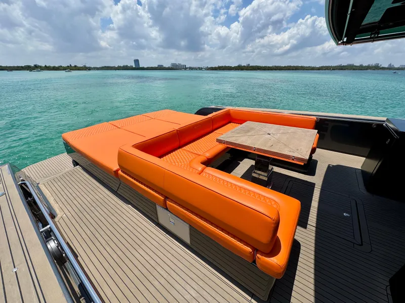 Slide: The Image of Luxury Pardo Yachts 50, 2023 model, featuring vibrant orange seating on deck. - 11
