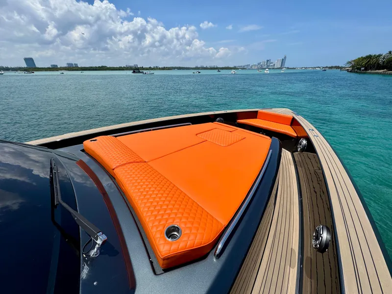 Slide: The Image of 2023 Pardo Yachts 50 with orange sunbed, cruising on clear blue waters. - 14
