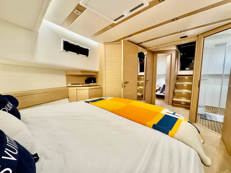 Slide: The Image of Luxurious cabin interior of 2023 Pardo Yachts 50, featuring modern design and cozy bedding. - 24